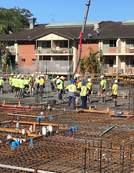 Many Workers Pumping Concrete ​​— Concreters in Coffs Harbour, NSW